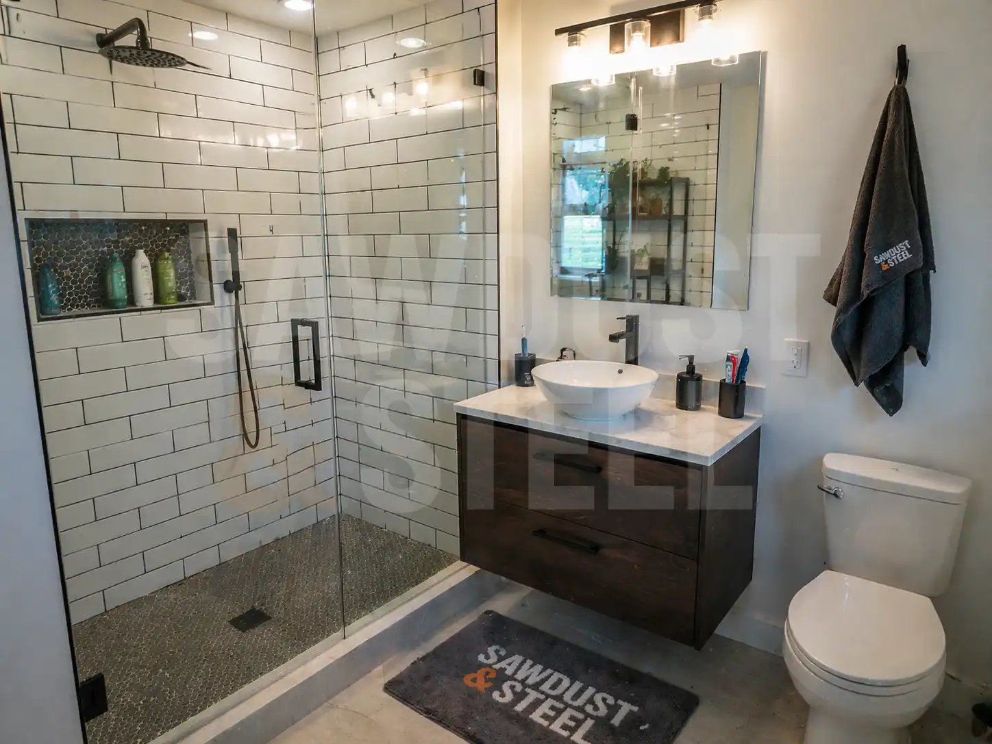 Subway tile curbless shower with frameless glass panel and floating vanity