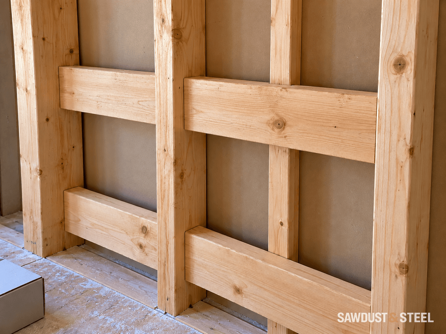 Two rows of solid timber backing between exposed vertical wall studs