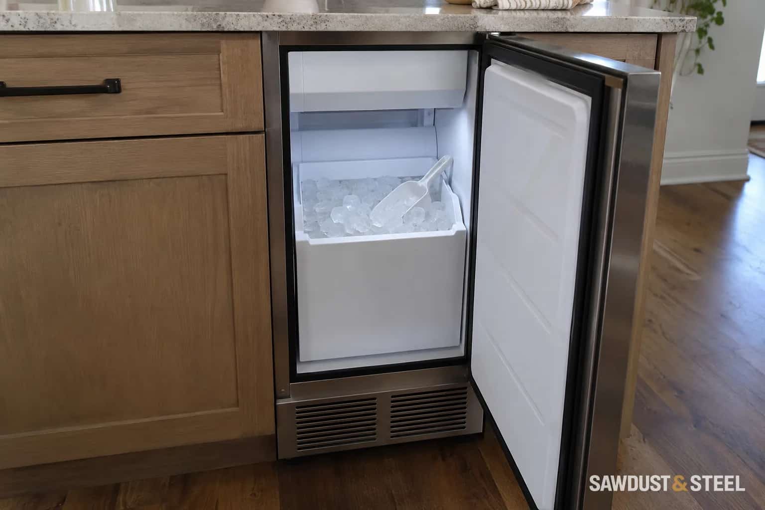 Open undercounter ice maker with an ice bin, scoop and lower ventilation grille