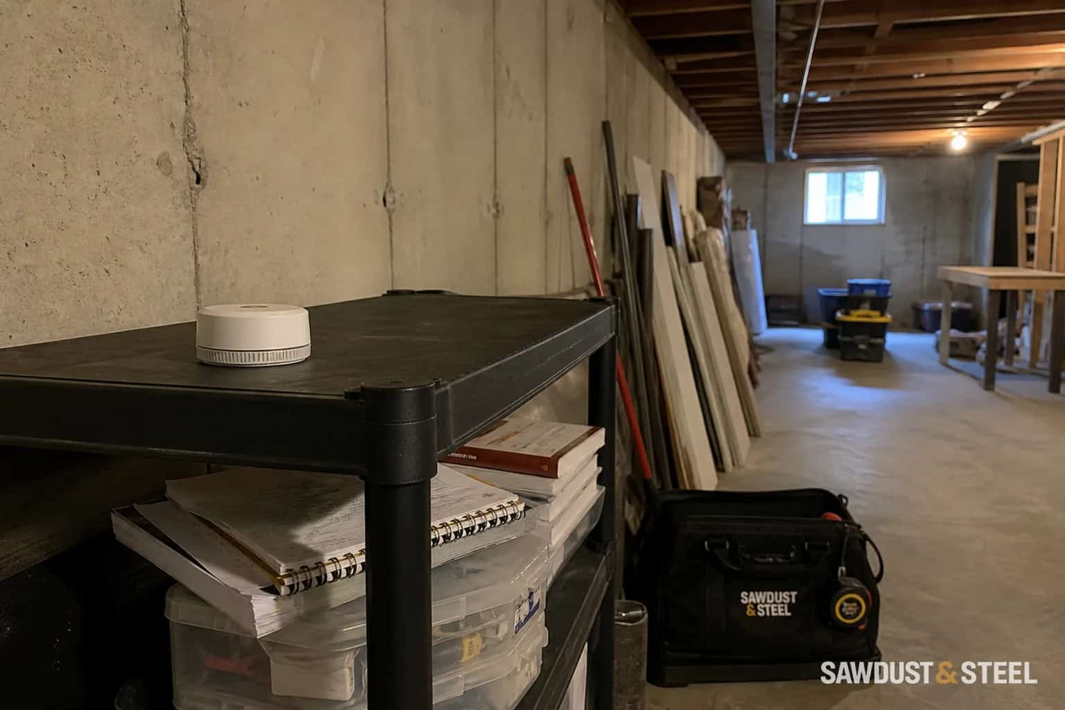 Editorial image of a radon detector in an unfinished basement planned for renovation