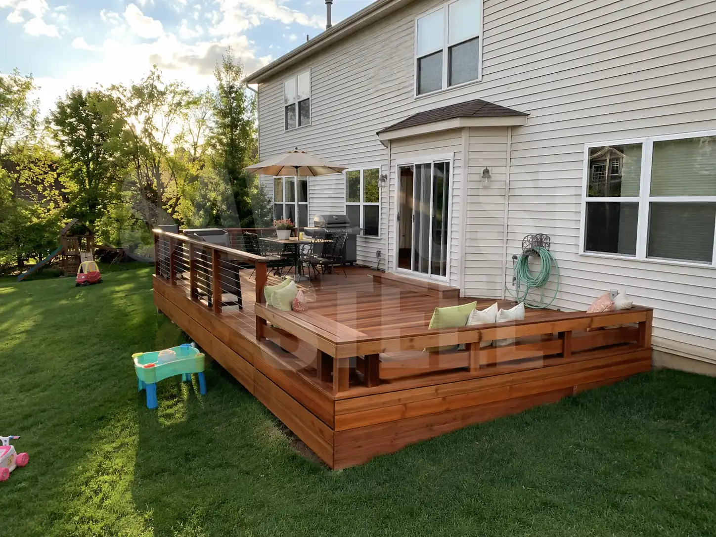 Cedar deck with a built-in bench in an Ontario backyard