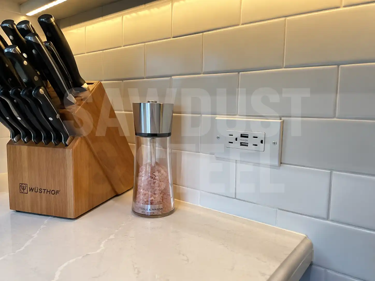 Kitchen cooking wall with range, hood, and subway tile backsplash