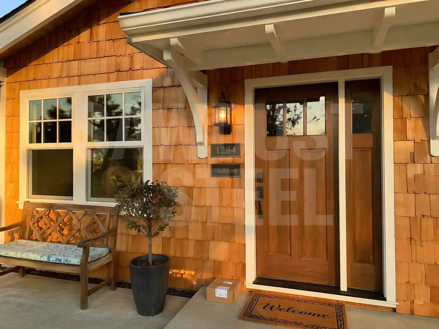 Cedar shake roof over a craftsman-style entry porch