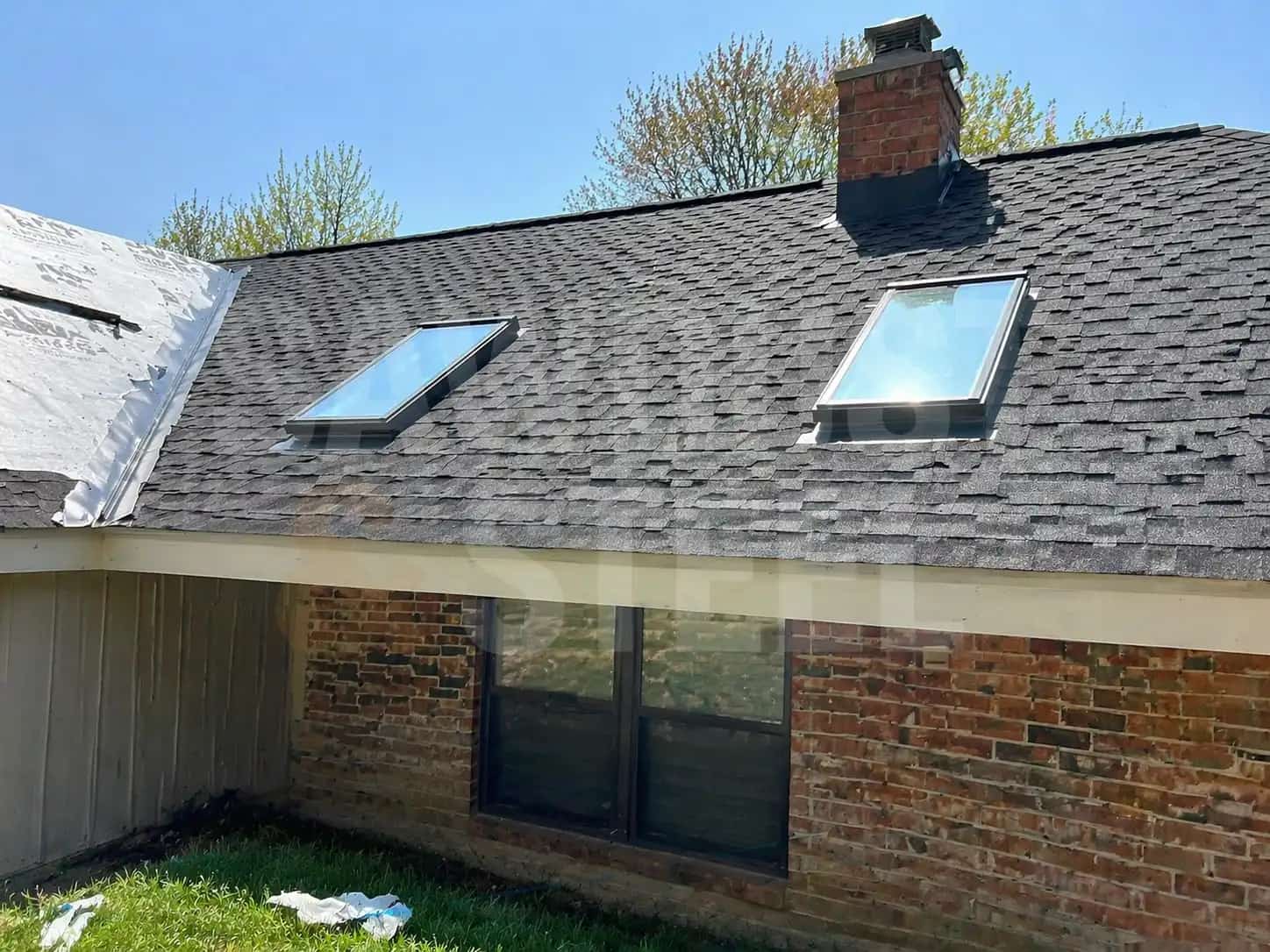Ontario shingle roof with skylights, chimney, valleys, and flashing