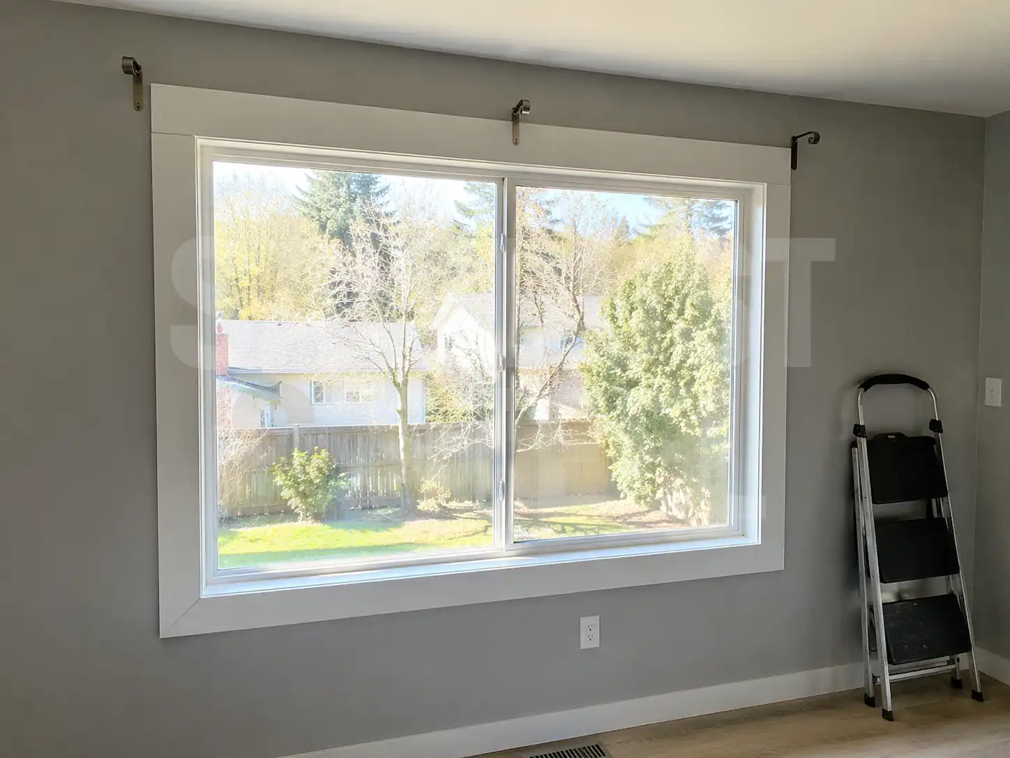 White window casing near barn door hardware